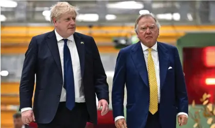  ?? ?? Boris Johnson and Lord Bamford, the JCB chair, visiting a JCB factory in India in April. Photograph: Ben Stansall/AFP/Getty Images