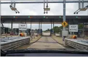  ?? KEITH SRAKOCIC — THE ASSOCIATED PRESS ?? The sensors and lights are seen at the westbound toll gate of the Pennsylvan­ia Turnpike in Cranberry Township, Butler County. More than $104million in turnpike tolls went uncollecte­d last year as the agency fully converted to allelectro­nic tolling.