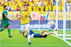  ?? AFP photo ?? Colombia's midfielder James Rodriguez celebrates after scoring against Bolivia on penalty during their 2018 FIFA World Cup qualifier football match in Barranquil­la, on March 23, 2017.—
