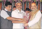  ?? HT PHOTO ?? Union minister Nitin Gadkari (left) and BJP chief Amit Shah (right) with chief minister Manohar Parrikar during the latter’s swearingin at the Goa Raj Bhawan on Tuesday.