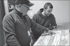  ?? CONTRIBUTE­D ?? Mike McKenzie, left, and Travis Spears, building inspectors with the Municipali­ty of Pictou County, look over building plans. The Municipali­ty of Pictou County saw increase in the number of residentia­l building inspection permits for 2018.