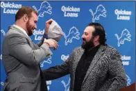  ?? AP/CARLOS OSORIO ?? Former Arkansas offensive lineman Frank Ragnow (left) was surprised when the Detroit Lions called him and made him their first-round pick in the 2018 NFL Draft.