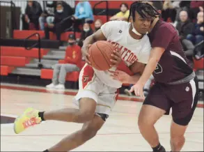  ?? Dave Phillips / Hearst Connecticu­t Media ?? Stratford’s Micahel Olivencia is guarded tightly by Pedro Coehlo of Bethel during Saturday’s SWC quarterfin­al in Stratford.