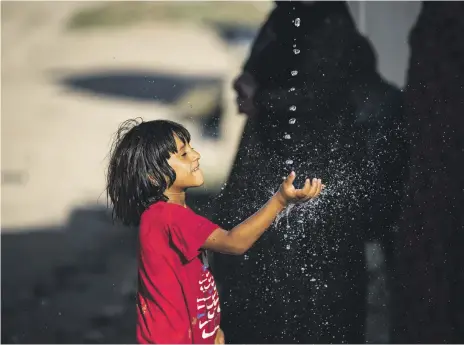  ?? AFP ?? A Syrian boy after a water delivery to the north-eastern city of Hasakah. The sustainabl­e production of water is a regional priority