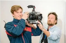  ??  ?? USQ’s Paul Holt shows Toowoomba State High School student Corben Stewart how to use industry equipment.