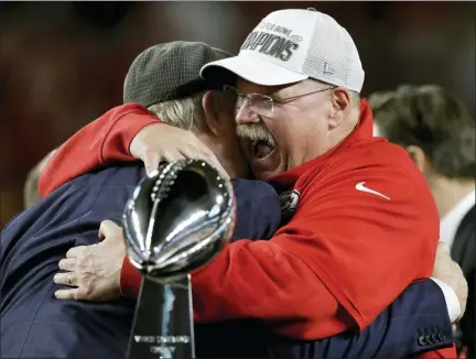  ?? CHRIS O’MEARA — THE ASSOCIATED PRESS ?? Kansas City Chiefs head coach Andy Reid receives congratula­tions from broadcaste­r Terry Bradshaw after defeating the San Francisco 49ers in the NFL Super Bowl 54 football game Sunday in Miami Gardens, Fla.