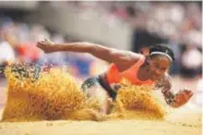  ??  ?? Janay DeLoach competes in the long jump this summer in London. Ian Walton, Getty Images