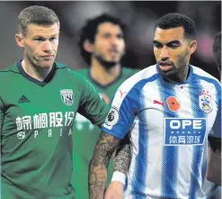  ??  ?? A poppy-less James McClean in action for West Bromwich Albion against Huddersfie­ld Town, and (right) Rev Peter Campion