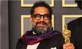  ?? Photograph: Mike Coppola/Getty Images ?? Joseph Patel celebrates winning the best documentar­y (feature) Oscar for Summer of Soul (...Or, When the Revolution Could Not Be Televised).