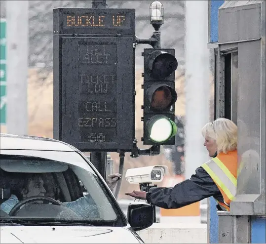  ?? Will Waldron / Times Union ?? Tolls are collected at Exit 22 of the New York Thruway in Selkirk. A cashless tolling system is being installed throughout the state Thruway system. Tollbooths will be removed next year.