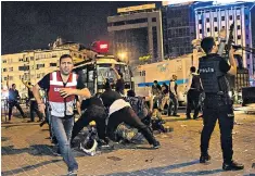  ??  ?? Military forces said to be in the uprising are held by police in Istanbul’s Taksim Square