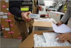  ??  ?? Johnson & Johnson doses arriving at vaccinatio­n site in Houston