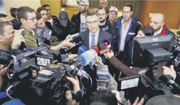  ?? PICTURE: AFP ?? 0 Gideon Saar speaks to the press after casting his ballot during a primary election vote by the governing Likud party