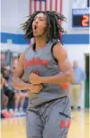  ?? KARL MERTON FERRON/STAFF ?? Spalding’s Malik Washington reacts after hitting a basket against Mount Carmel during Thursday’s MIAA A Conference semifinal.