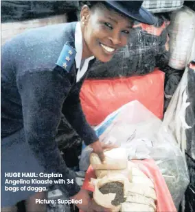  ?? Picture: Supplied ?? HUGE HAUL: Captain Angelina Klaaste with 34 bags of dagga.