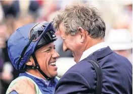  ??  ?? All smiles Legendary jockey Frankie Dettori celebrates with Mark Johnston after riding the trainer’s 4194th domestic British winner