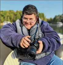  ?? COURTESY OF MICHAELA COOPER ?? Jonathan Gross, who has Down syndrome, has been involved with Connectabi­lity since age 2. He plans to launch his own photograph­y business after graduating high school.