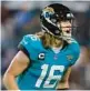  ?? COURTNEY CULBREATH/GETTY ?? After throwing four INTs, Trevor Lawrence tossed four TD passes to lead the Jaguars over the Chargers on Saturday night in the third-largest comeback in NFL playoff history.