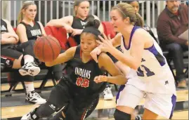  ?? Jeremy Stewart / Rome News-Tribune ?? Chattooga’s Ziyah Underwood (left) tries to get around Armuchee’s Livia Skinner during the opening round of the Region 7-AA tournament Monday at Chattooga High School.
