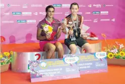  ??  ?? HONG KONG: Winner Tai Tzu-ying of Taiwan (R) poses with second-placed P.V. Sindhu of India after the women’s singles final at the Hong Kong Open badminton tournament in Hong Kong yesterday. — AFP