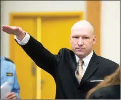 ?? JONATHAN NACKSTRAND/AFP ?? Norwegian mass killer Anders Behring Breivik makes a Nazi salute as he arrives in court on March 15 in Skien.
