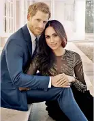  ??  ?? ROYAL COVER UP: Official photograph released on Thursday of the royal couple’s engagement reveal Megan in nude-colored lining to make the see through 56,000 pound Ralph & Russo gown more modest