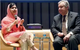  ?? AFP ?? Malala speaks as UN chief Antonio Guterres looks on at the UN headquarte­rs in New York . —