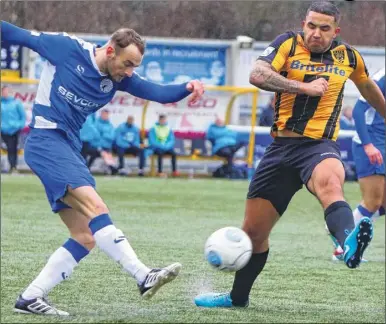  ?? FM5067511 left, FM5067504 above, Buy these pictures from kentonline.co.uk ?? Skipper Stuart Lewis closes Gateshead down, left, and, above, Jai Reason blocks a clearance from the visitors