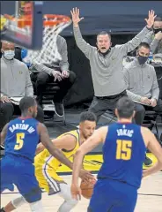  ?? Aaron Ontiveroz / The Denver Post ?? Nuggets coach Michael Malone shouts instructio­ns from the bench during a Jan. 14 game against the Warriors at Ball Arena in Denver.