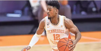  ?? BRIANNA PACIORKA/NEWS SENTINEL ?? Tennessee guard Victor Bailey Jr (12) dribbles the ball during a game against South Carolina at Thompson-boling Arena in Knoxville on Feb. 17. Bailey is averaging 18.2 points in his last five games.