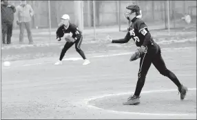  ?? MARK HUMPHREY ENTERPRISE-LEADER ?? Prairie Grove senior Laney Layman delivers a pitch for the Lady Tigers. Layman (59 pitches) alternates with junior Madie Stearman (39 pitches) in the chalked circle. Both threw three innings during a 10-3 loss at Pea Ridge on Monday, March 5.