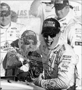  ?? MATT SULLIVAN/GETTY ?? Joey Logano celebrates in victory lane after winning Sunday’s race in Las Vegas.