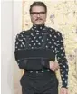  ?? JORDAN STRAUSS/INVISION ?? Pedro Pascal arrives wearing a Bottega Veneta outfit and a sling Jan. 7 at the Globes.