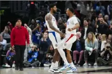  ?? Ryan Sun/Associated Press ?? Clippers forward Paul George, left, and guard Norman
Powell react after scoring the go-ahead basket during the second half Sunday against the Cavaliers in Los Angeles.