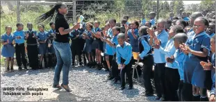  ??  ?? WORD FUN: Nokuphiwa Tshabane with pupils