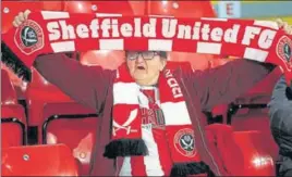  ?? GETTY IMAGES ?? Sheffield United was in last place in the third division not so long ago, but is now sixth in the Premier League.