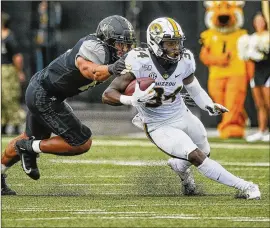  ?? GETTY IMAGES ?? Missouri’s star running back Larry Rountree III has averaged 5 yards per carry for his 644 yards and eight touchdowns this season. On Saturday, he’ll face the only team in college football that hasn’t allowed a rushing touchdown in 2019.