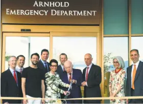  ?? Norm Cummings 2015 ?? Hundreds watched as the Arnhold family performs ribbon-cutting honors for the Arnhold Emergency Department at New Milford (Conn.) Hospital in 2015.