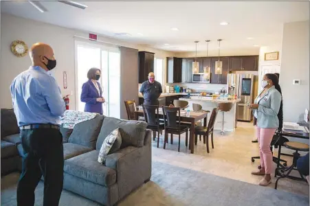  ??  ?? U.S. Sen. Catherine Cortez Masto, D-nev., second from left, tours the Canyon View transition­al living home Thursday. The Canyon View living home, operated by the nonprofi group Rite of Passage and The Embracing Project, will allow child traffickin­g and sexual exploitati­on victims to transition back to normal life in a safe and secure environmen­t.