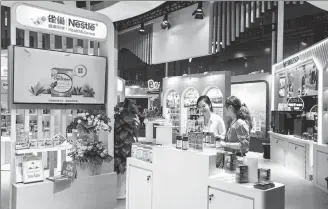  ?? PROVIDED TO CHINA DAILY ?? Visitors check out Nestle products during the sixth China Internatio­nal Import Expo in Shanghai in November.