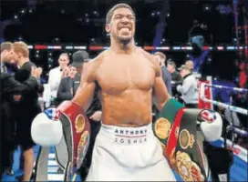  ?? REUTERS ?? Anthony Joshua celebrates his win against Alexander Povetkin as he retained the WBA, IBF, WBO and IBO world heavyweigh­t titles at the Wembley Stadium in London on Saturday.