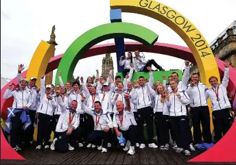  ??  ?? Victory parade: Scotland’s medal winners celebrate in Glasgow’s George Square