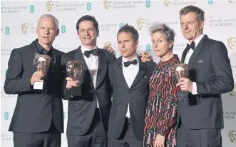  ??  ?? Martin McDonagh, left, producer Peter Czernin, second left, actor Sam Rockwell and producer Graham Broadbent, right, pose with Frances McDormand, second right, after receiving the award for Best Film for Three Billboards Outside Ebbing, Missouri.