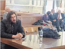  ?? DOUGLASS DOWTY THE ASSOCIATED PRESS ?? Michael Rotondo, left, sits during an eviction proceeding in Syracuse, N.Y., brought by his parents, Mark and Christina. The two parents confer with their lawyer, Anthony Adorante, in the court gallery behind.