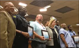 ?? CORNELIUS FROLIK / STAFF ?? Dayton city commission­ers honored city employees from various department­s for their service to residents.