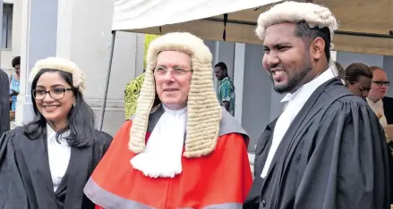  ?? Photo: Ronald Kumar ?? Chief Justice Anthony Gates, with new lawyers Namrata Singh (left) and John Prasad after their admission to the bar.