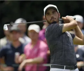  ?? NICK WASS — THE ASSOCIATED PRESS ?? Abraham Ancer, of Mexico, watches his tee shot on the third tee during the third round of the Quicken Loans National golf tournament, Saturday in Potomac, Md.