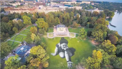  ?? Message From Future Picture:EPA-EFE ?? A picture taken with a drone shows the giant landart painting,by French artist Saype, in the park La Perle du Lac in Geneva, Switzerlan­d, at the weekend. The artwork covers 5 000m2.