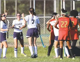  ?? PHOTO BY ROB WORMAN ?? La Plata senior Madison Taylor, far left center, celebrates with teammates Haley Farrell and Maddie Moyer after scoring the game-winning goal with 1 minute 38 seconds left in regulation in Tuesday’s 2-1 win victory over North Point in a SMAC Potomac...