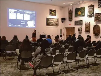  ?? Lau Guzmán/Hearst Connecticu­t Media ?? Reggaetón historian Nina Vazquez speaks about the history of the genre at the Connecticu­t Museum of Culture and History in Hartford, April 11.